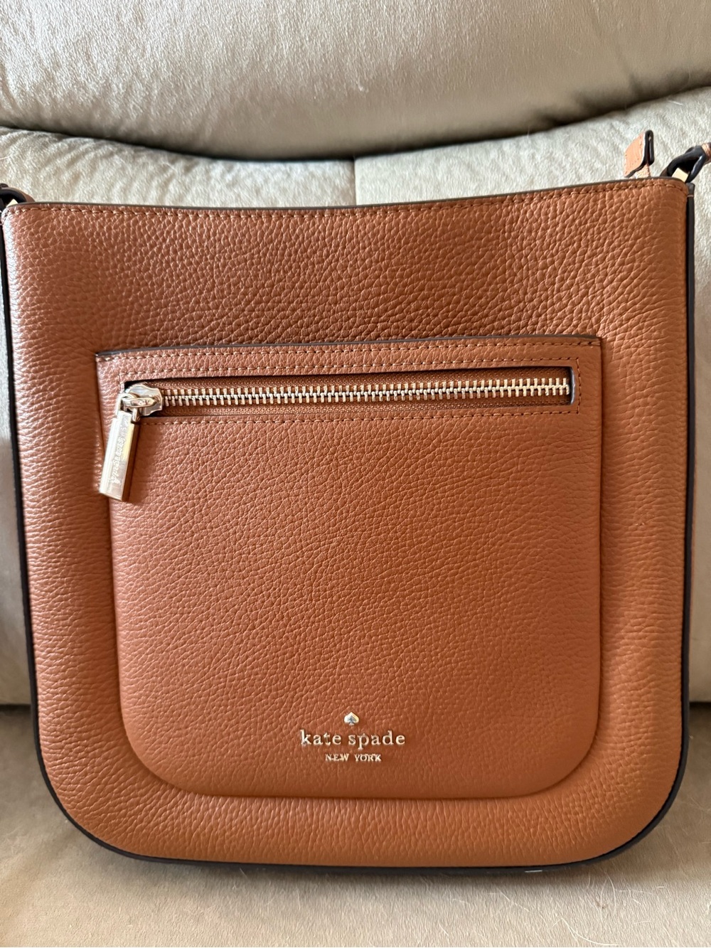 kate spade tan pebbled leather crossbody with front zip pocket